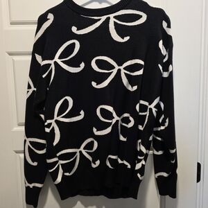 Chic Black Sweater with White Bow Pattern